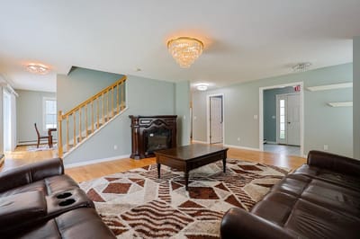 Bright common area with seating and a chandelier