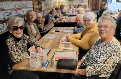 Seniors enjoying a meal together in a dining area.