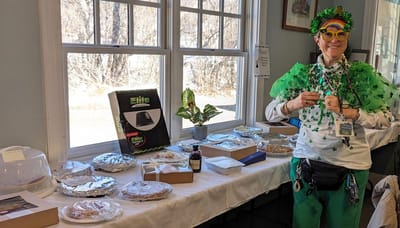 Staff member celebrating with food and decorations.