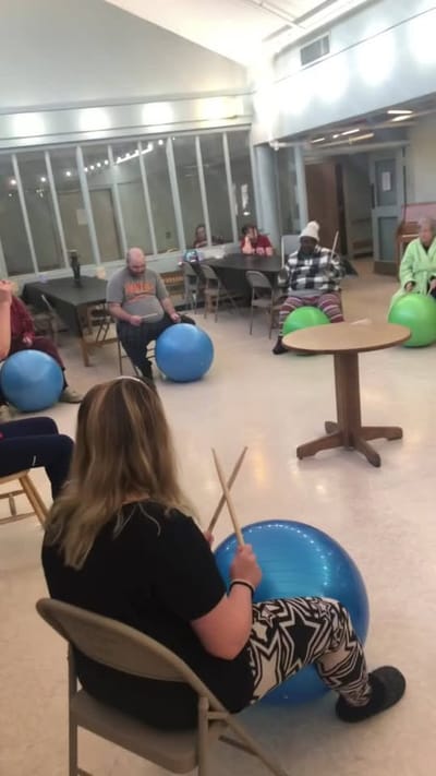 Residents participating in an activity with exercise balls.