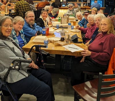 Residents enjoying a meal together at a dining area.