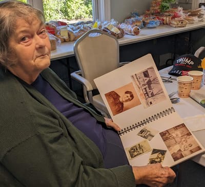 Resident sharing memories from a photo album.
