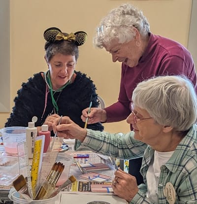 Residents engaged in an arts and crafts activity.