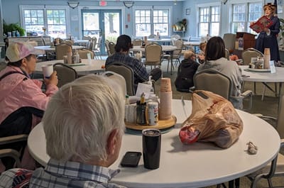 Residents enjoying an activity in the dining area.