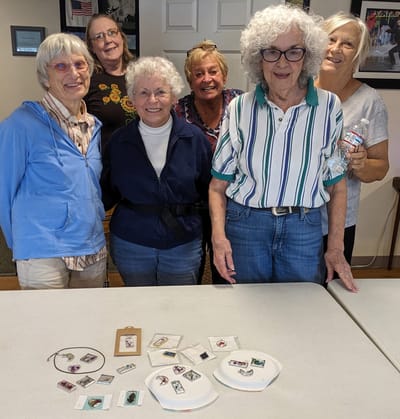 Residents engaged in a craft activity together.