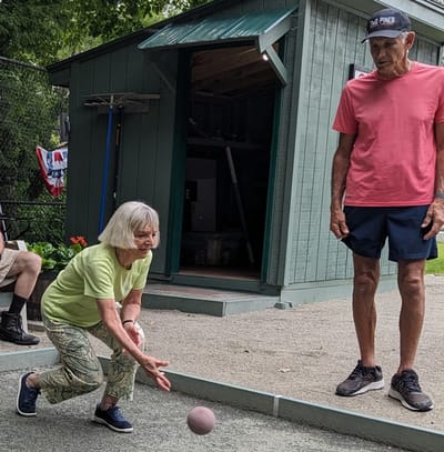 Residents playing a game outdoors.