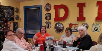 Group of residents enjoying a meal together.