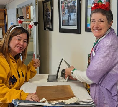 Two women enjoying a fun indoor activity together.