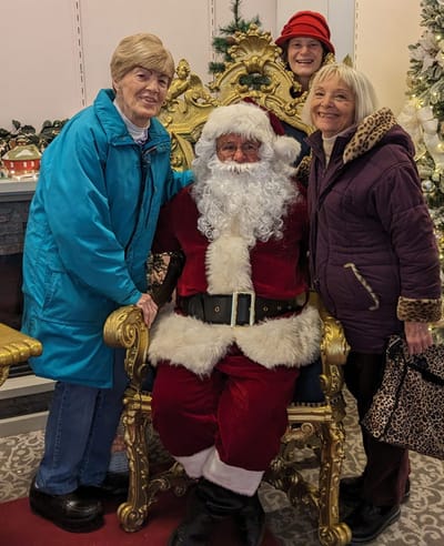 Residents posing with Santa during a holiday event