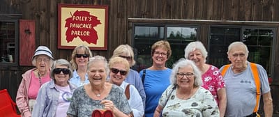 Group of residents enjoying an outing at a pancake parlor.