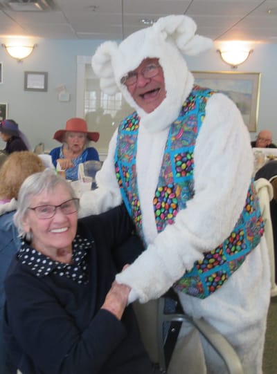 Resident enjoying time with a costumed entertainer.