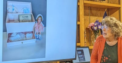 Resident engaging with a doll in a common area