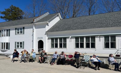Residents enjoying the outdoors on a sunny day.