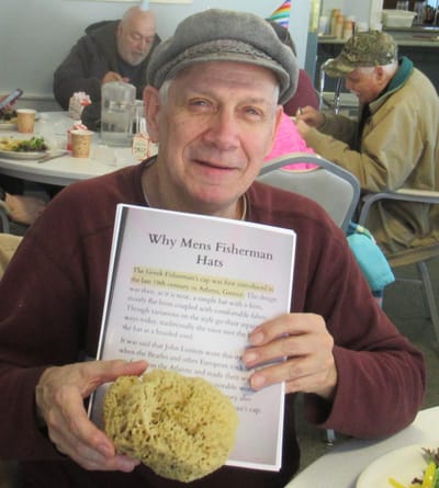 Resident enjoying a group activity with a sponge