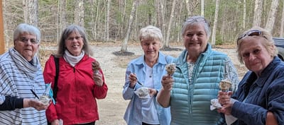 Residents enjoying ice cream outdoors with friends
