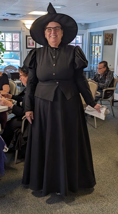 Resident in costume participating in a festive activity.