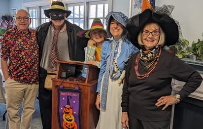 Residents and staff dressed for Halloween celebration.