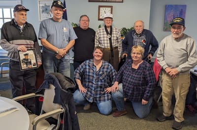 Group of residents and staff in a common area