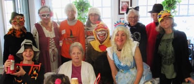 Group of residents in costumes celebrating an event