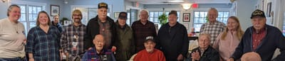 Group of residents and staff smiling together