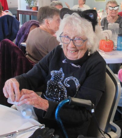 Senior resident engaging in a festive activity.