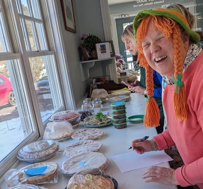 Residents enjoying a baking activity in the common area.