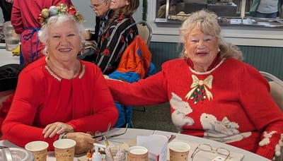 Two residents enjoying a festive gathering.