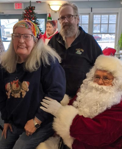 Residents enjoying a festive event with Santa