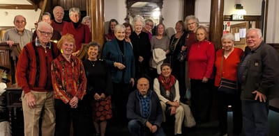 Residents and staff gather for a group photo.
