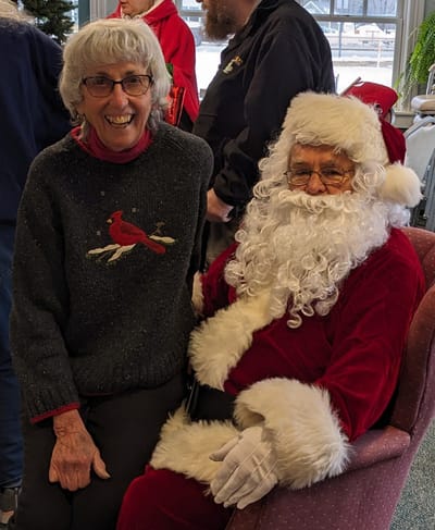Resident and Santa celebrating together