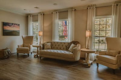 Bright interior common area with a cozy couch