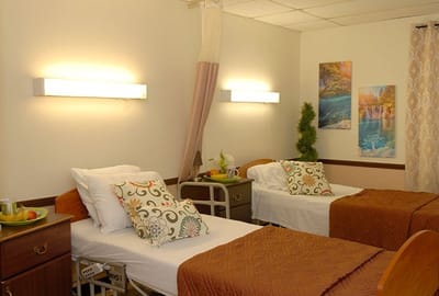 Well-decorated shared resident room with two beds