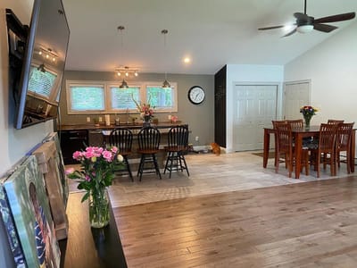Bright common area with dining setup and flowers