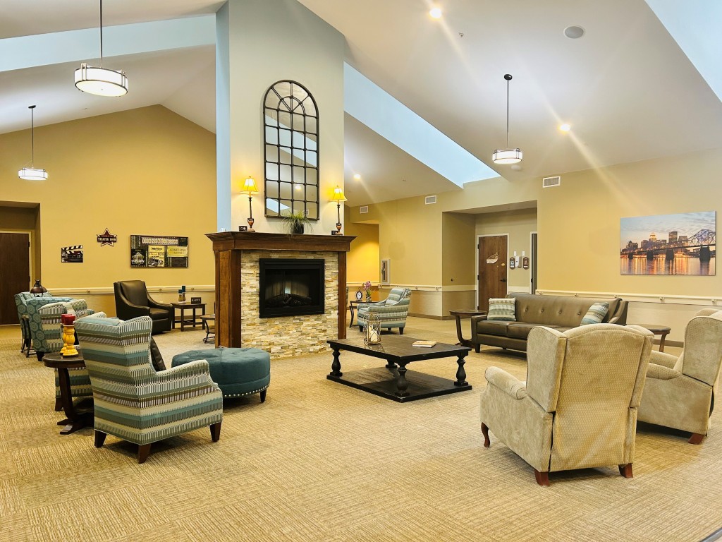 Interior common area with seating and a fireplace