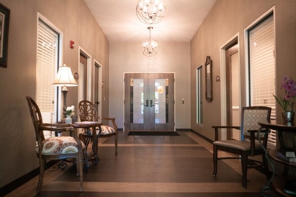 Interior hallway with seating and decorative lighting