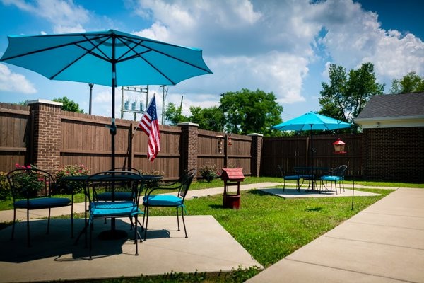 Outdoor patio area with umbrellas and seating