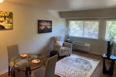 Cozy common area with a dining table and artwork