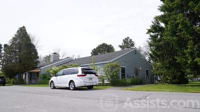 Exterior view of Pride House with vehicle