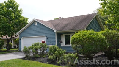 Exterior view of a residential-style building with landscaping