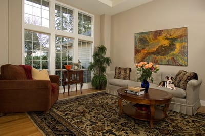 Warm living room with flowers and a dog