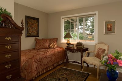 Cozy resident room with a bed and window view.