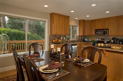 Bright kitchen area with dining table and outdoor view