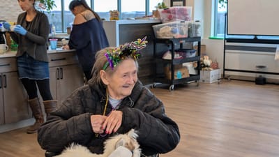 Resident enjoying a festive gathering with decorations.