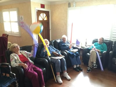 Residents enjoying a fun activity in a common area.