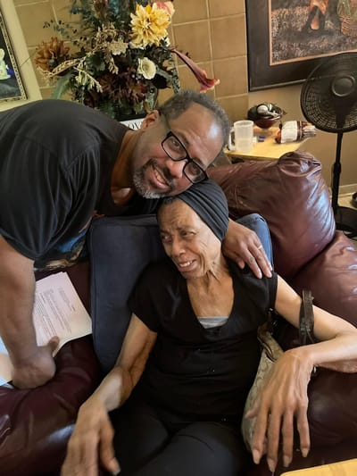 Residents sharing a joyful moment in a common area.