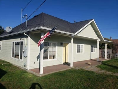 Exterior view of a residential facility with an American flag.
