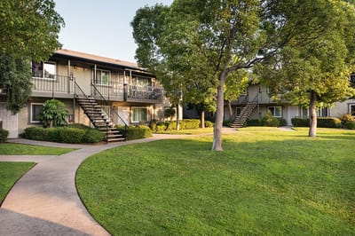 Well-kept outdoor area with buildings and green space.