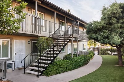 Exterior view of a facility with landscaped greenery.
