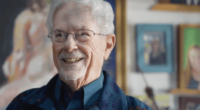 Smiling elderly man in an interior setting