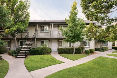 Exterior view of Melody Lane with walkways and gardens.